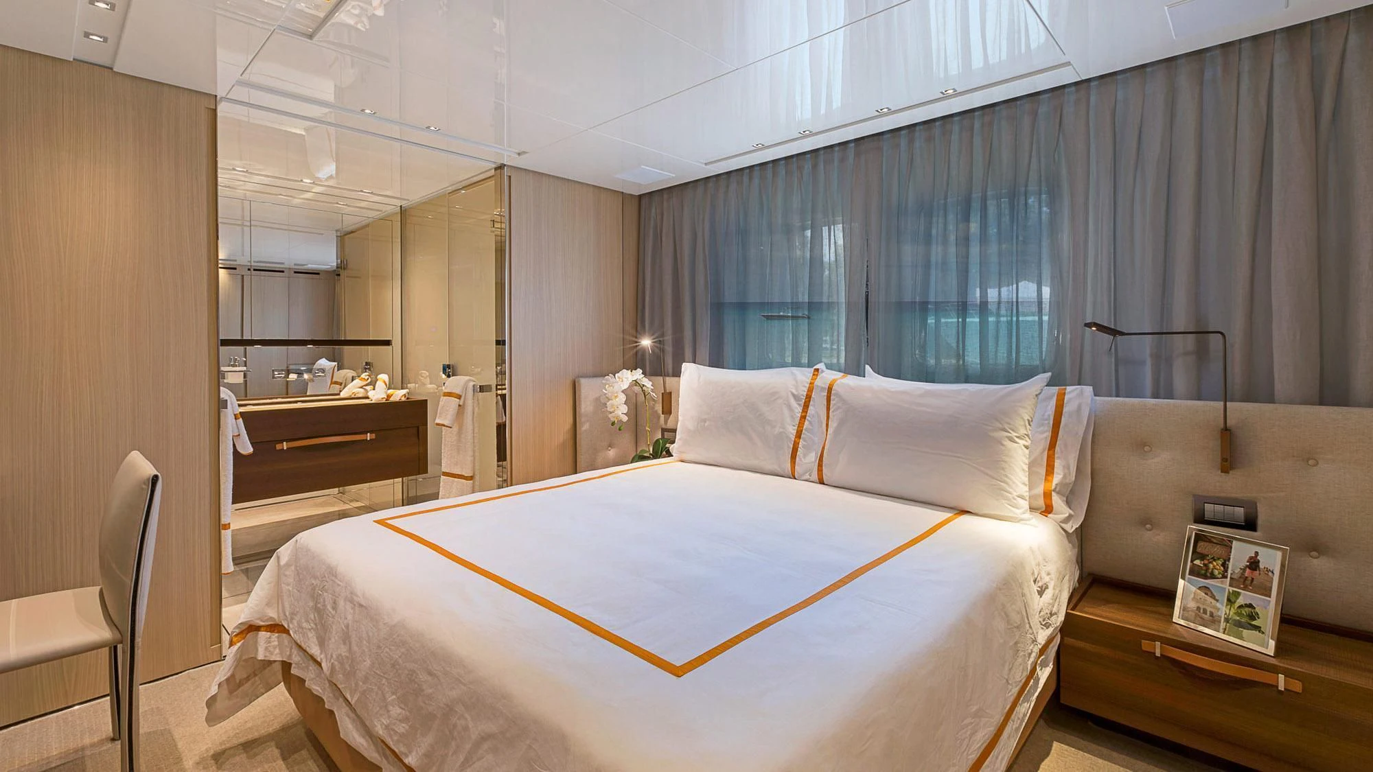 a bedroom with a bed and desk aboard CLEAR EYES Yacht for Sale