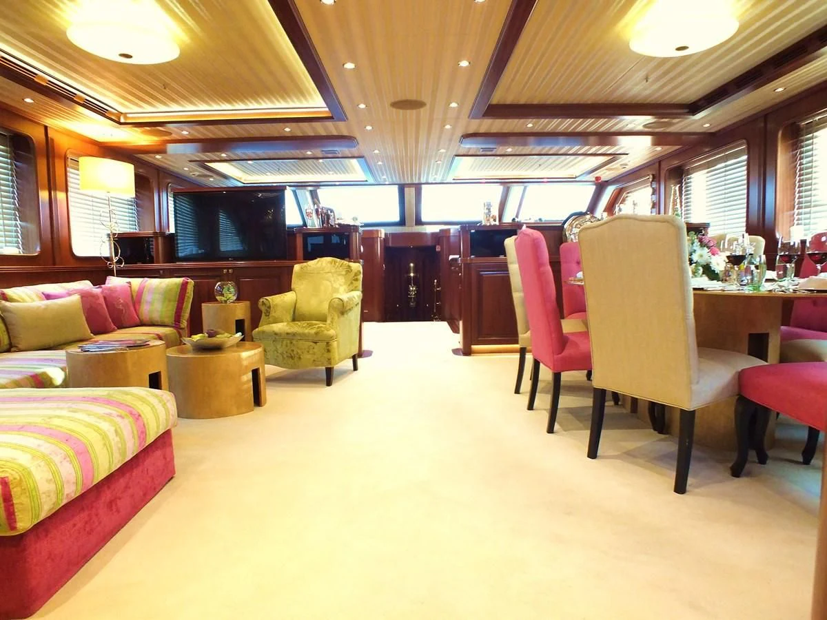 a room with a couch and chairs aboard CLEAR EYES Yacht for Sale