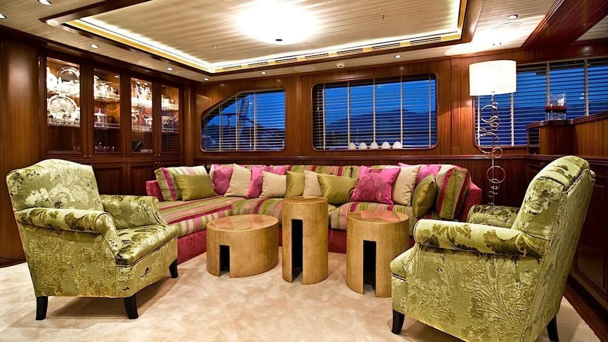 a living room with couches and a table aboard CLEAR EYES Yacht for Sale