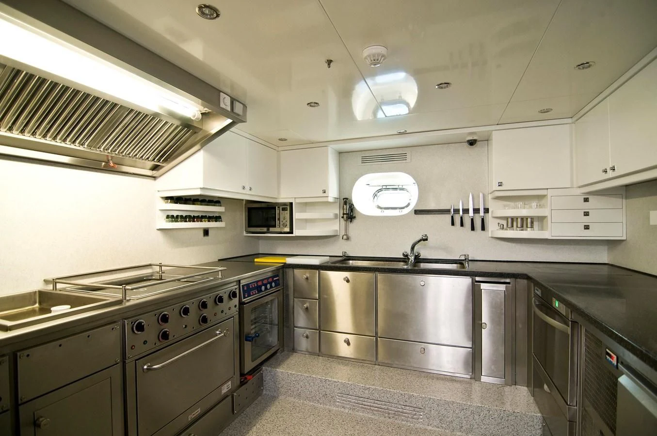 a kitchen with stainless steel appliances aboard CLEAR EYES Yacht for Sale