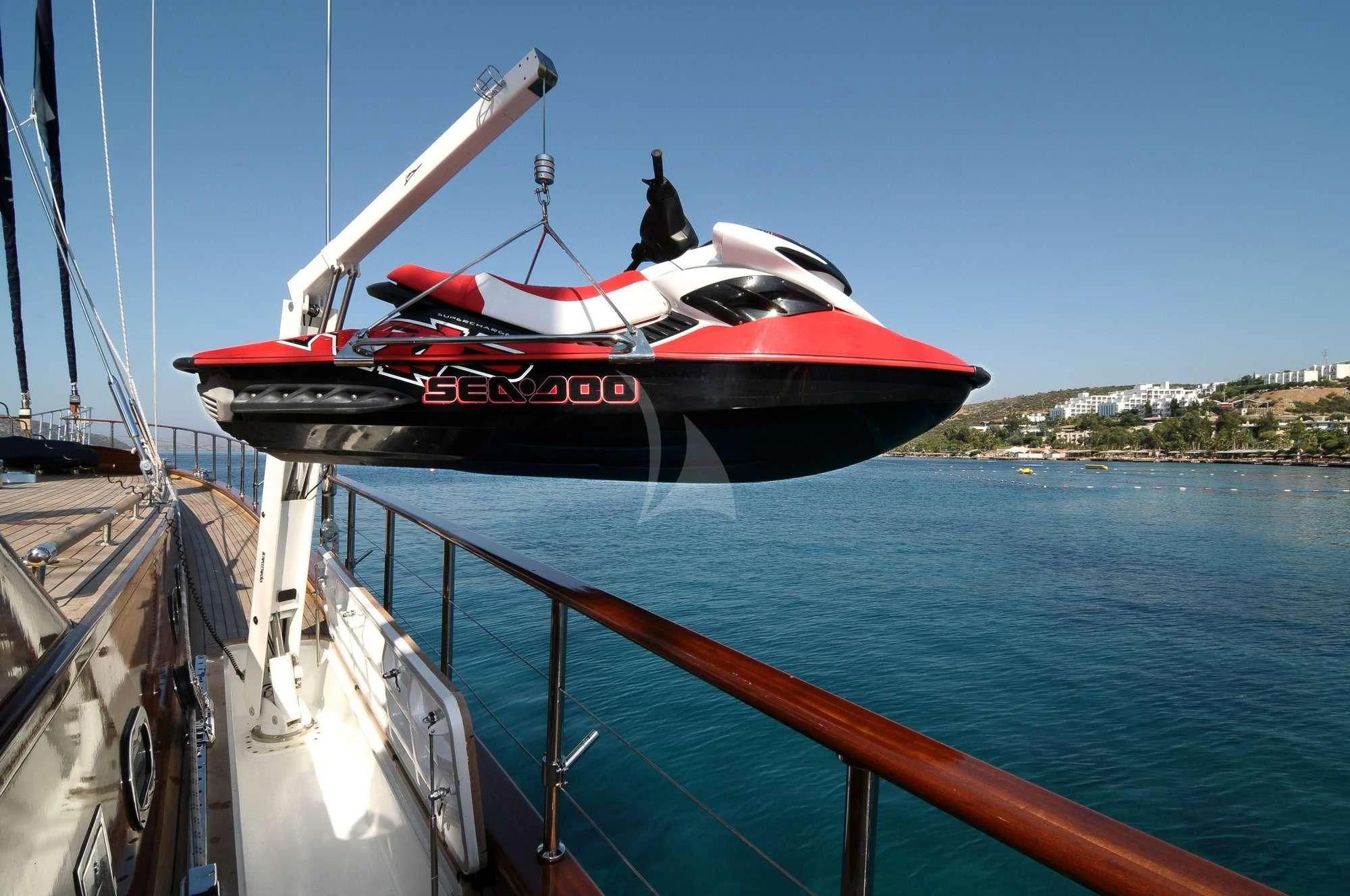 a red and black boat on a body of water aboard CLEAR EYES Yacht for Sale