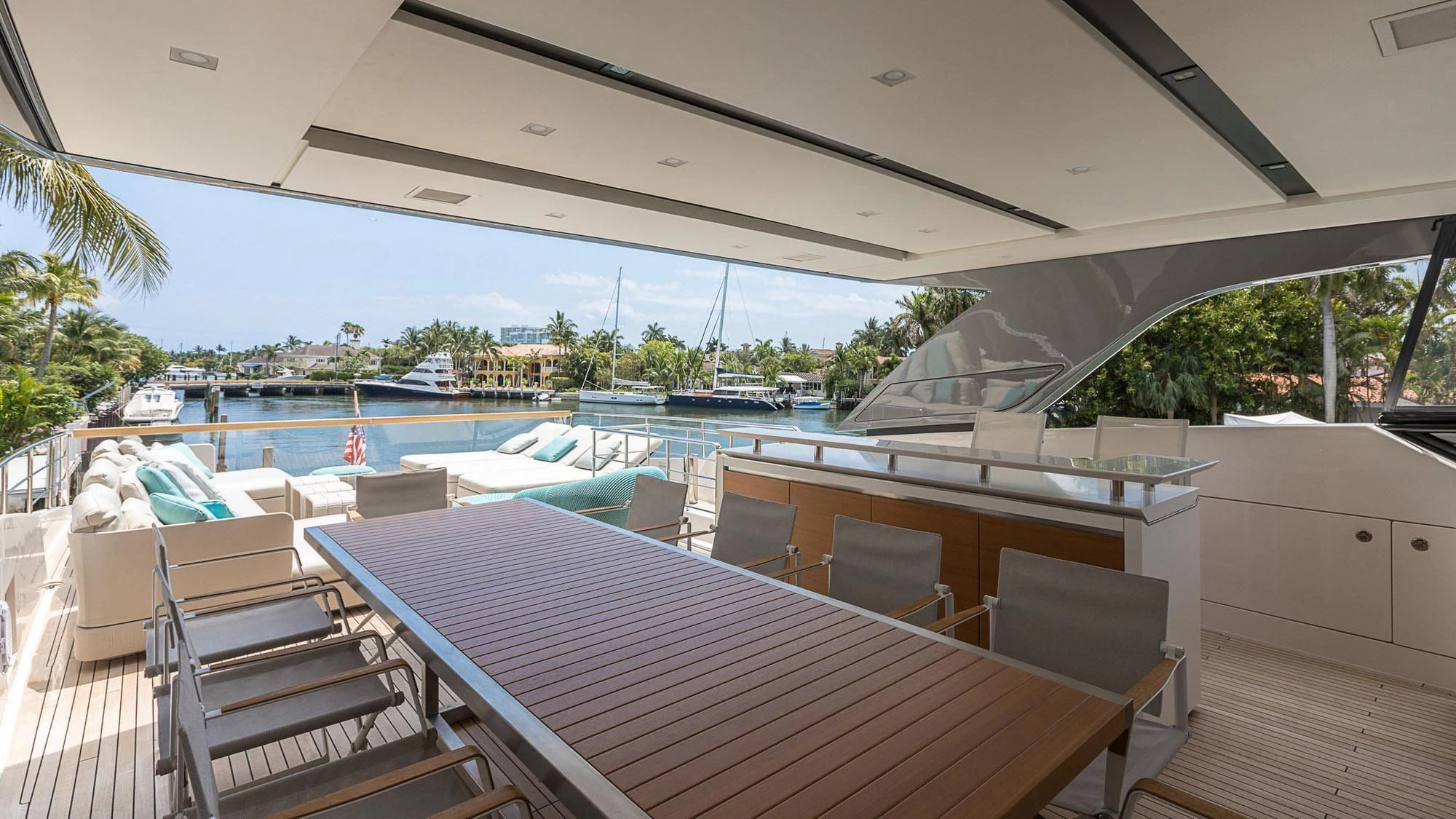 a deck with a pool and a deck with chairs and a deck aboard CLEAR EYES Yacht for Sale