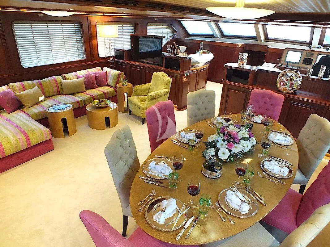 a dining room with a table and chairs aboard CLEAR EYES Yacht for Sale
