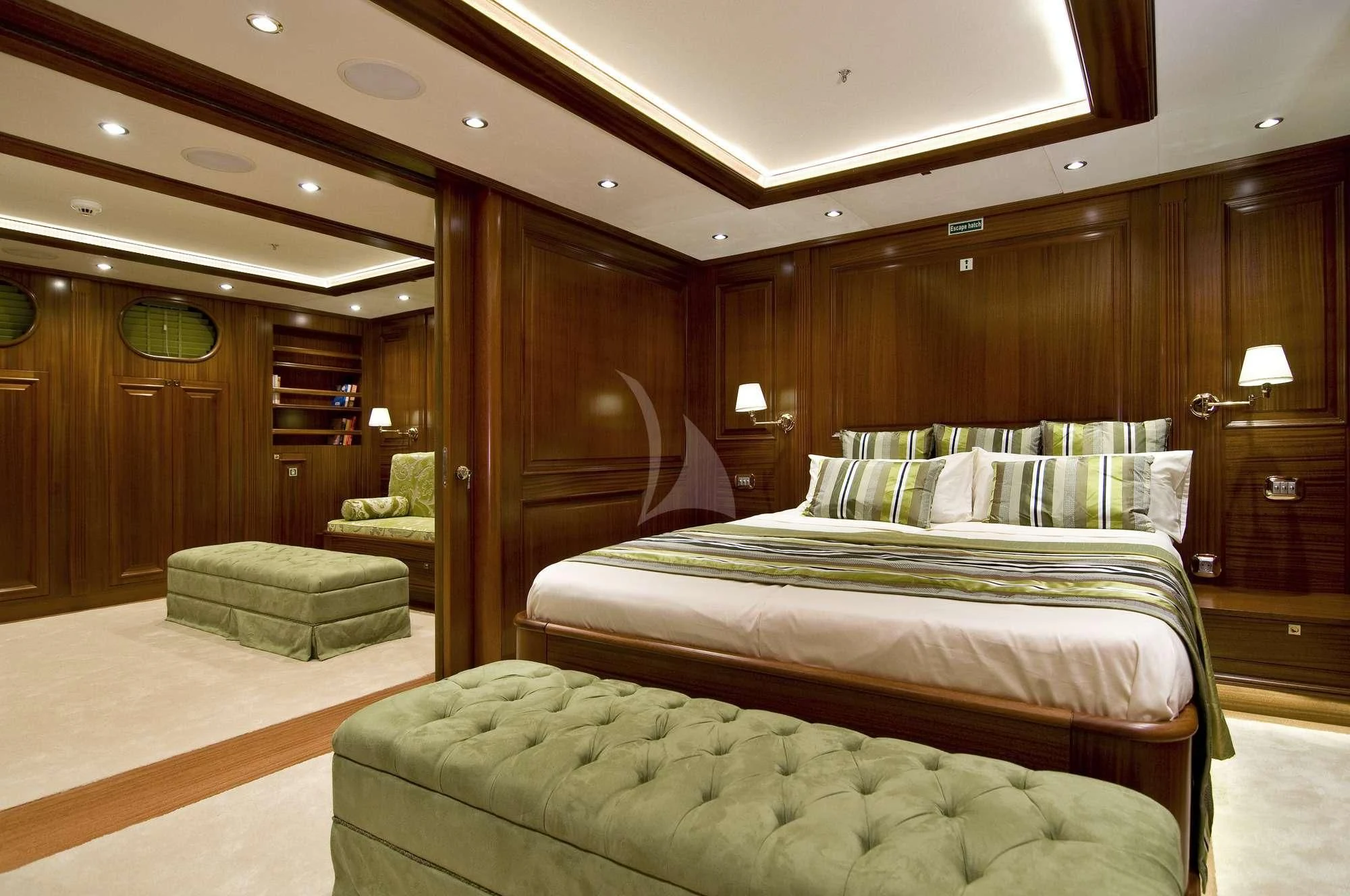 a room with a bed and a chair aboard CLEAR EYES Yacht for Sale