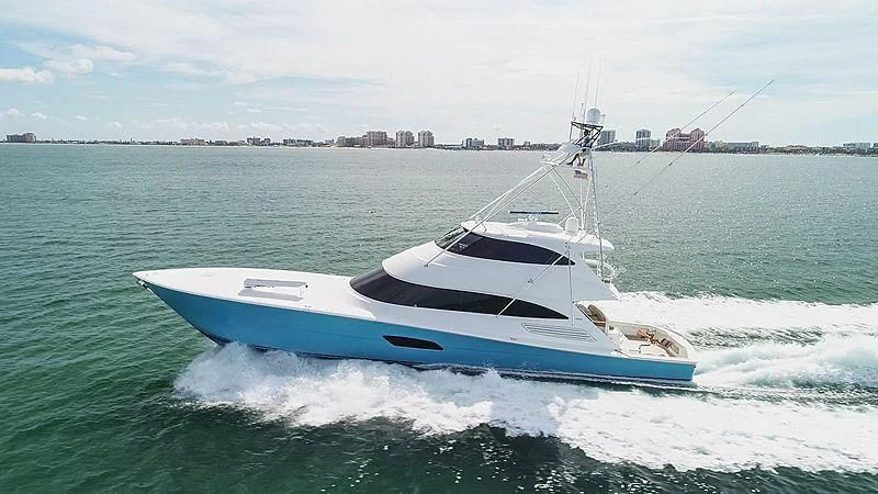 a white boat on the water aboard HIGH COTTON Yacht for Sale