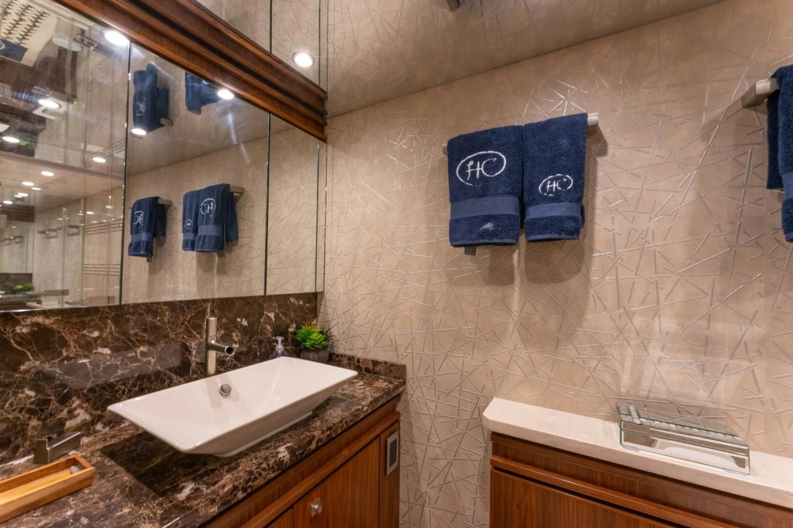 a bathroom with a large mirror aboard HIGH COTTON Yacht for Sale