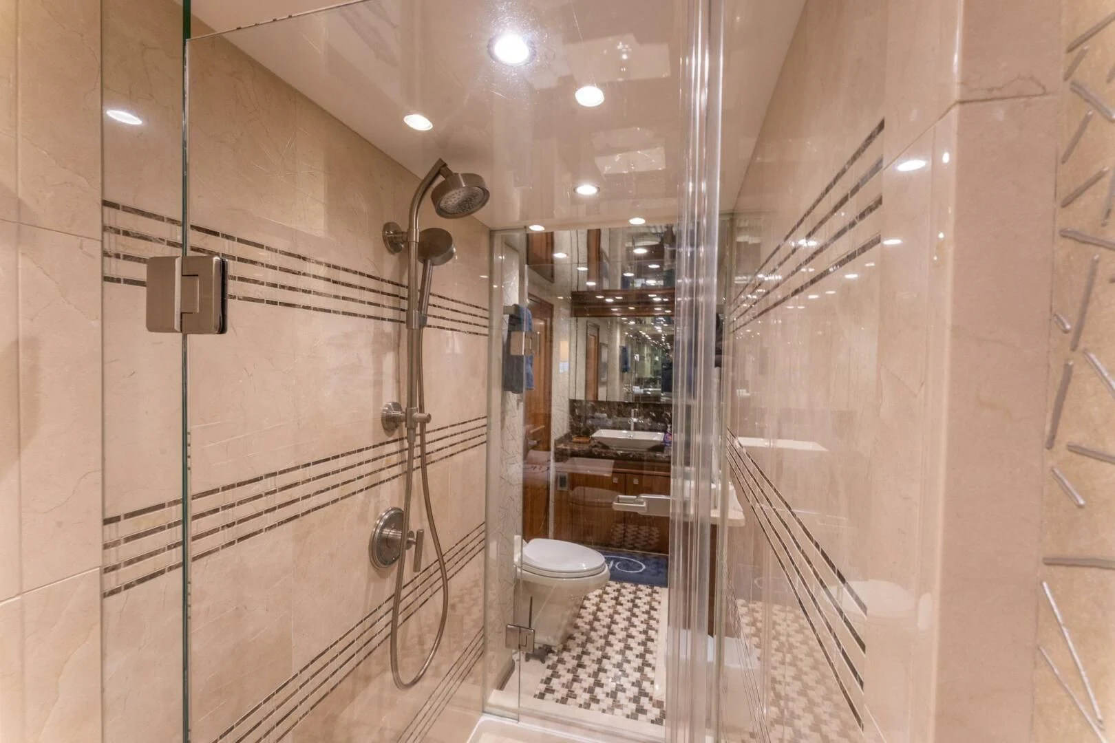 a bathroom with a glass shower aboard HIGH COTTON Yacht for Sale
