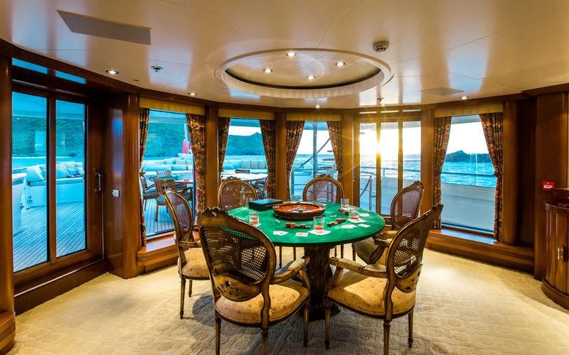 a dining table and chairs aboard HARMONY Yacht for Sale