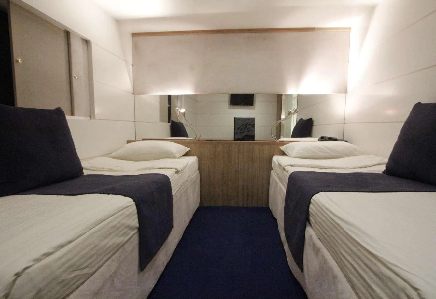 a room with several beds aboard HARMONY Yacht for Sale