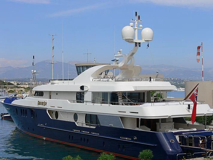 a large boat with a helicopter on top of it aboard HARMONY Yacht for Sale