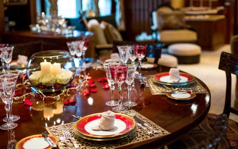 a table with plates and glasses aboard HARMONY Yacht for Sale