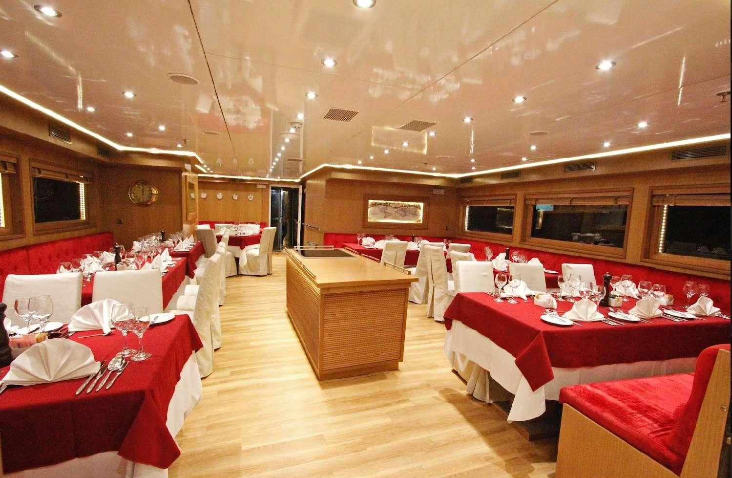 a room with tables and chairs aboard HARMONY Yacht for Sale