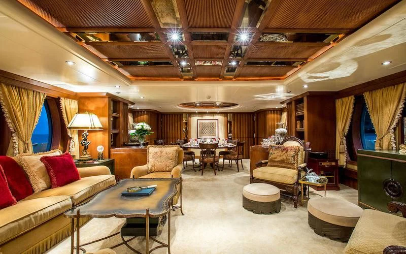 a living room with a couch and a table aboard HARMONY Yacht for Sale