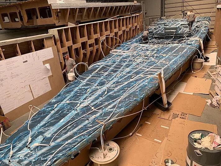 a large metal structure with a blue tarp on it aboard MOKA III Yacht for Sale