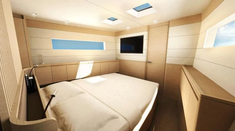 a room with a bed and a television aboard MOKA III Yacht for Sale