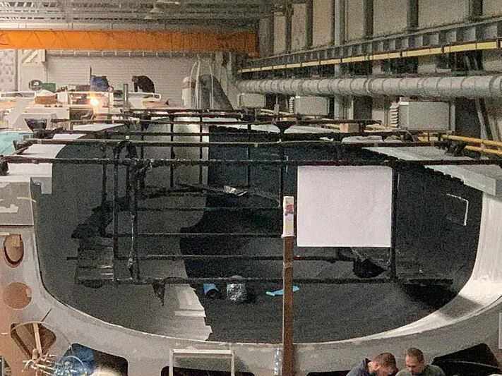 a large machine with a group of people in it aboard MOKA III Yacht for Sale