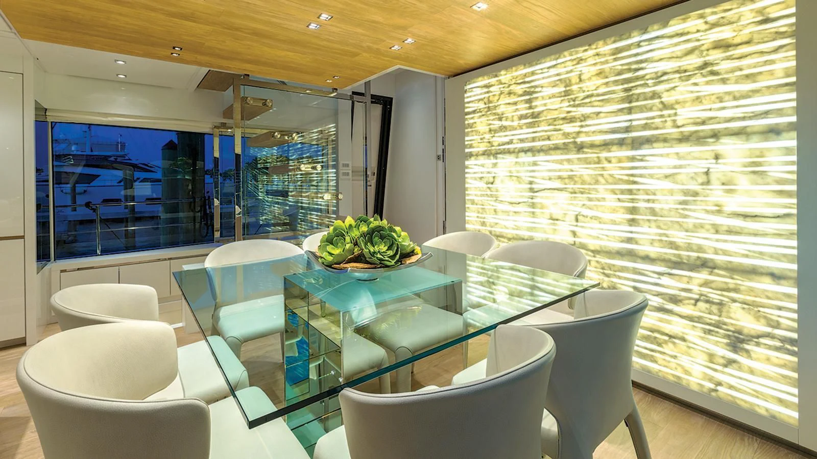 a room with a table chairs and a large window aboard SEASUN Yacht for Sale