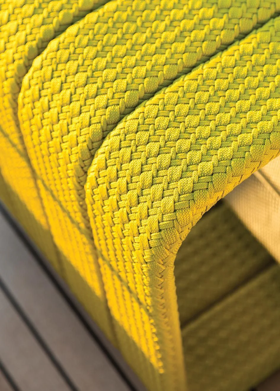 a close-up of a yellow and black patterned chair aboard SEASUN Yacht for Sale