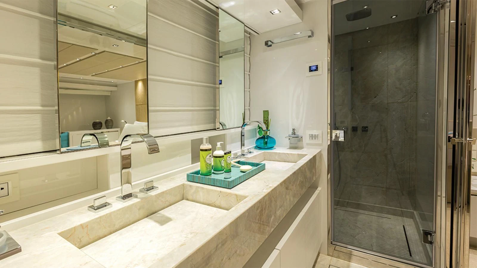 a bathroom with a countertop sink and a shower aboard SEASUN Yacht for Sale