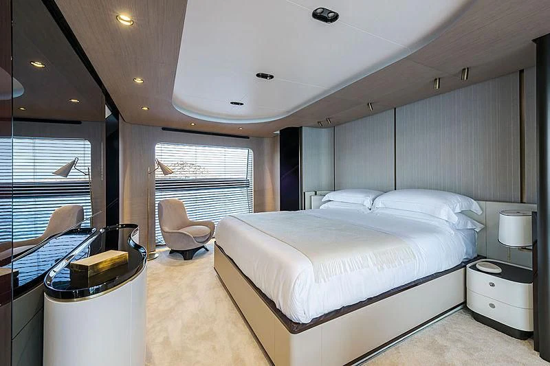 a room with a bed and a chair aboard R.DARENBEN Yacht for Sale