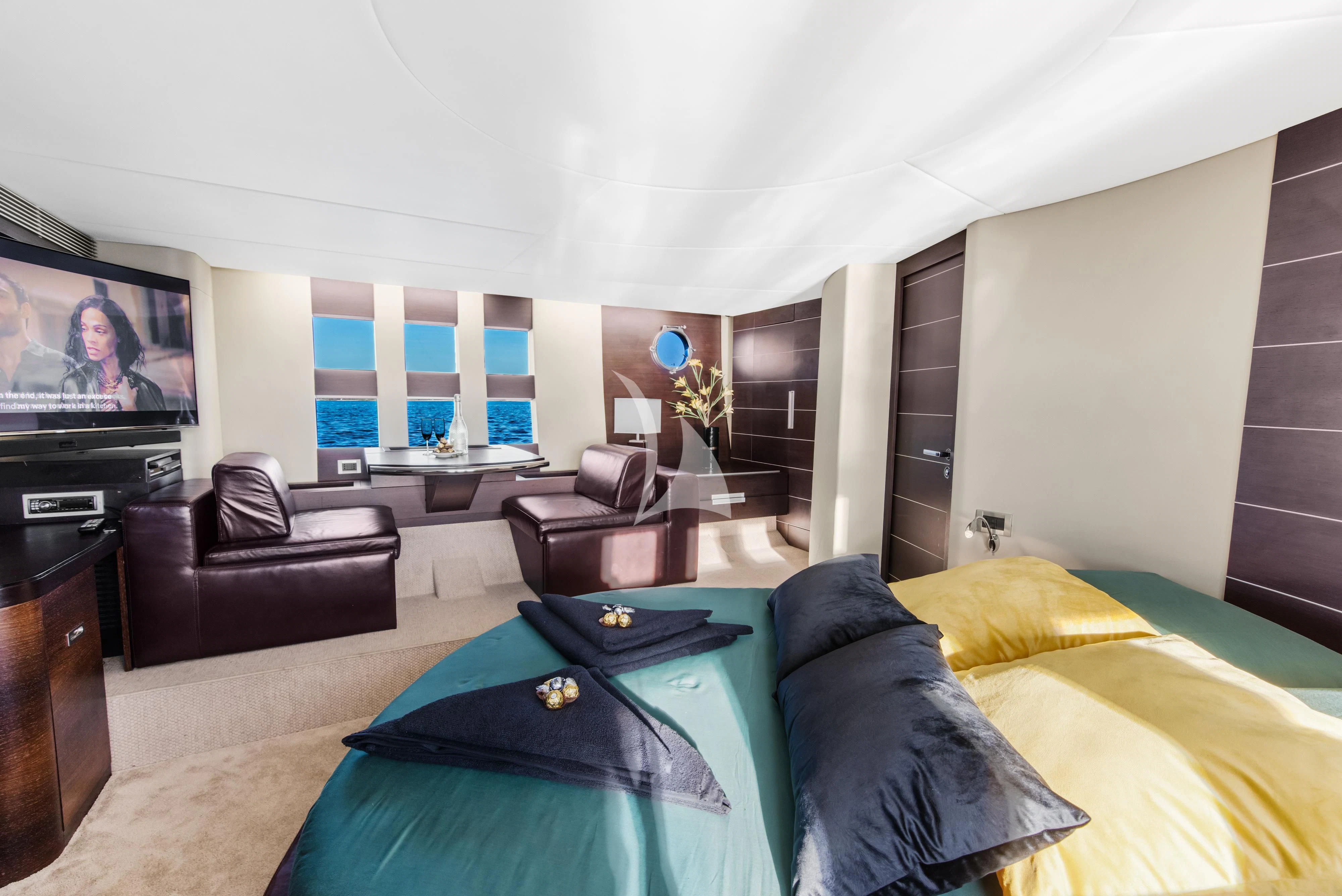 a living room with a large tv aboard FALCH Yacht for Charter