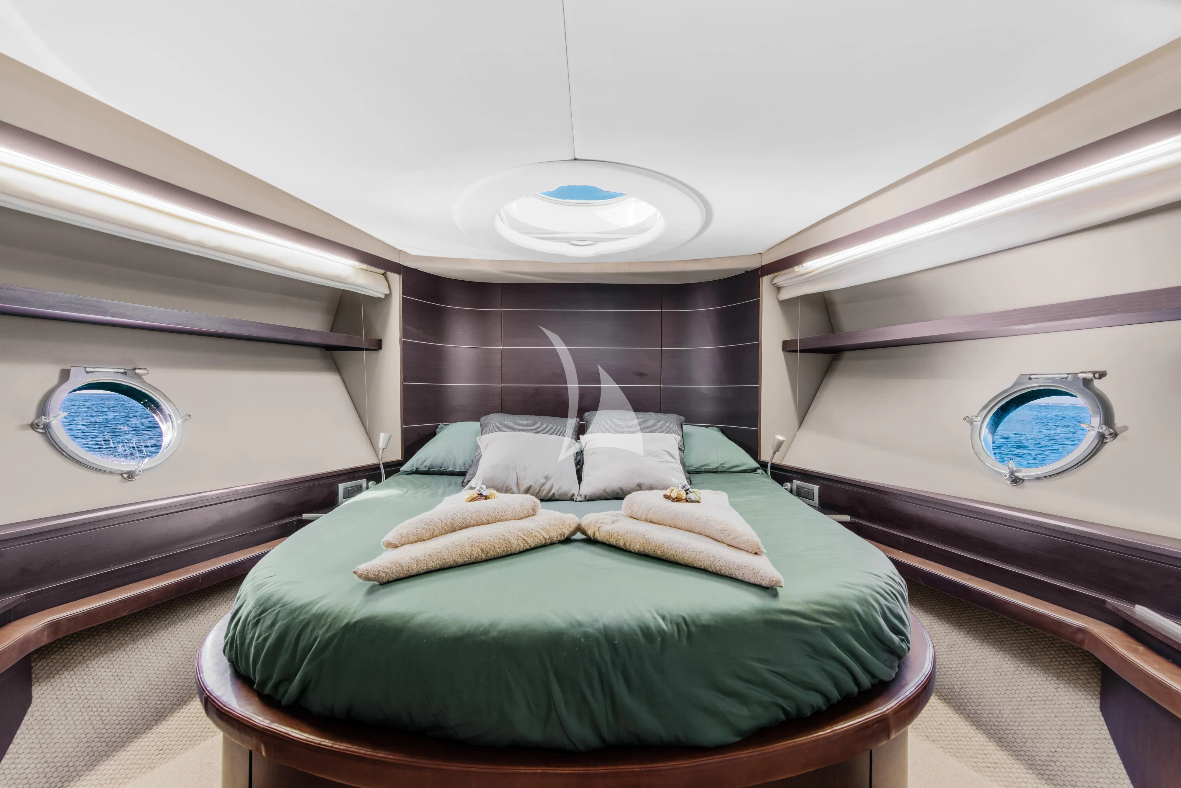 a bed in a room aboard FALCH Yacht for Charter