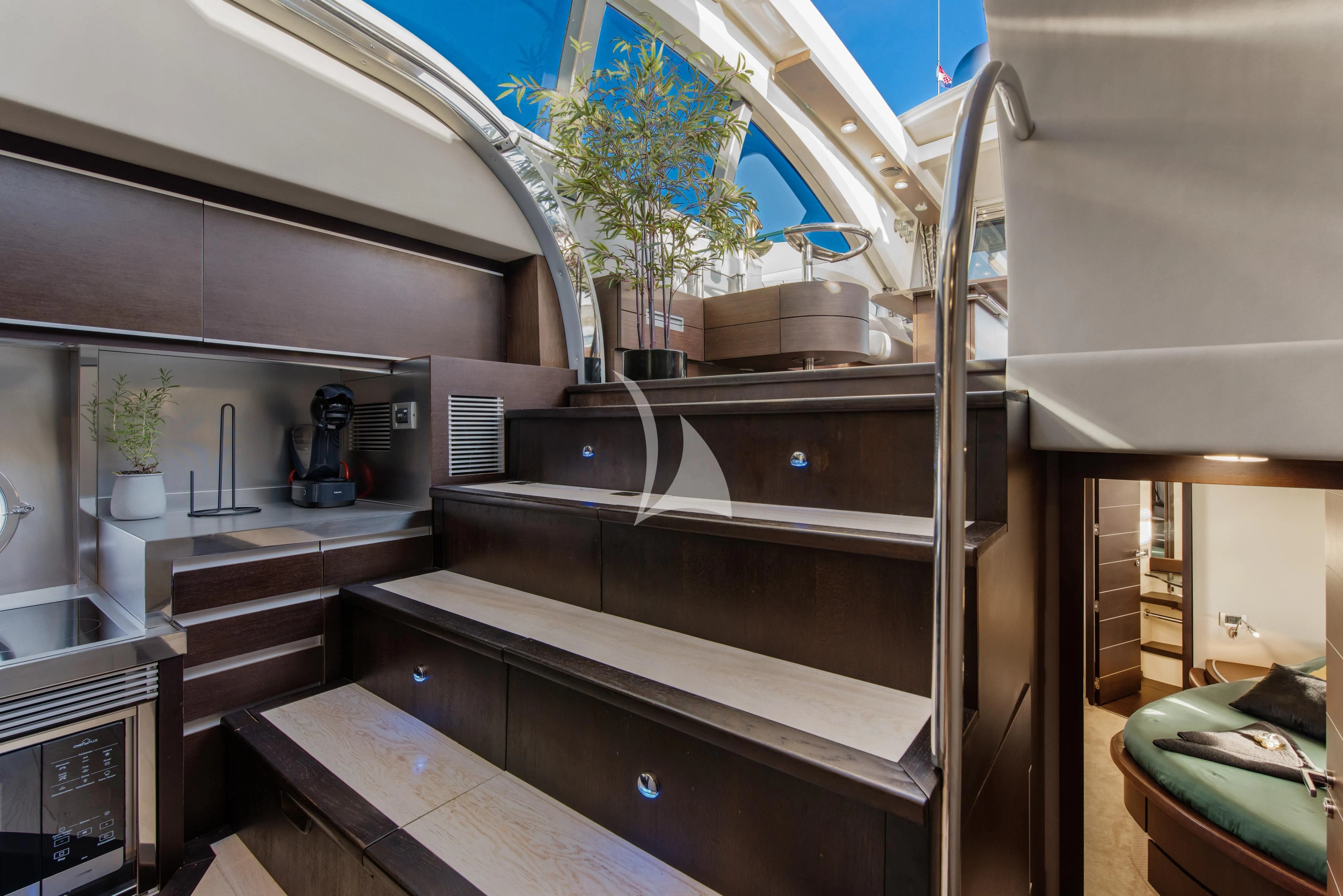a kitchen with a glass wall aboard FALCH Yacht for Charter