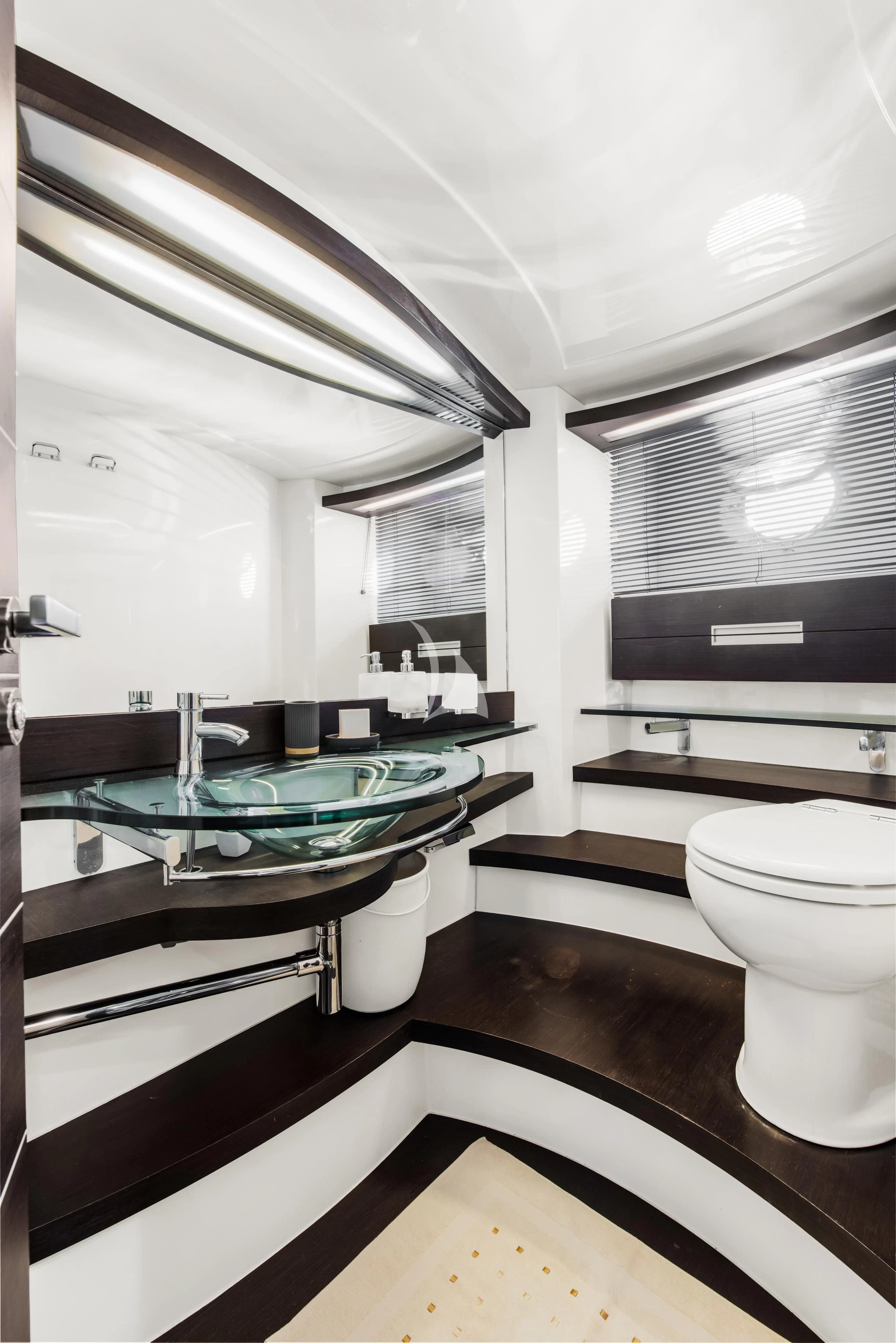 a bathroom with a sink and a toilet aboard FALCH Yacht for Charter