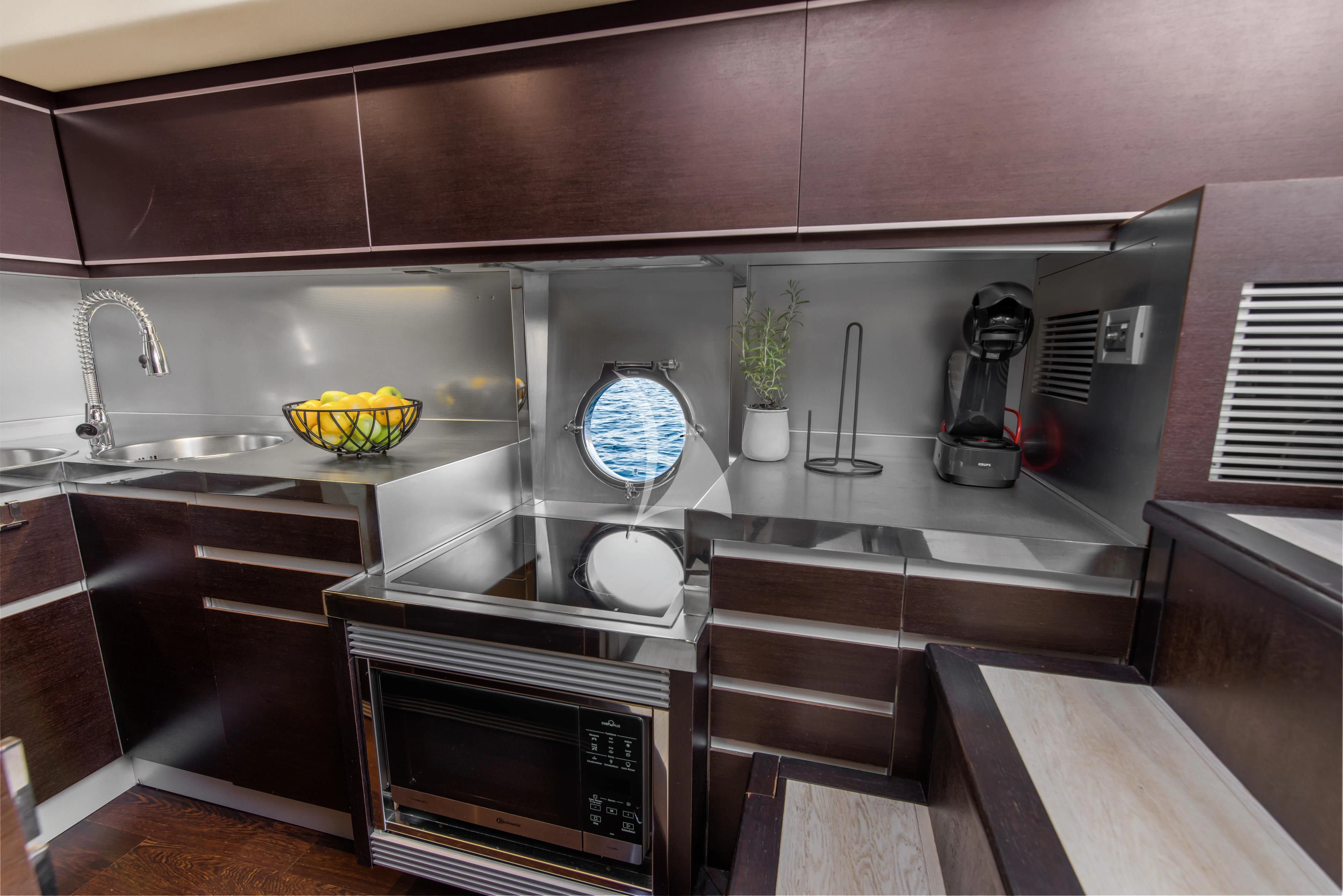 a kitchen with a sink and a stove aboard FALCH Yacht for Charter