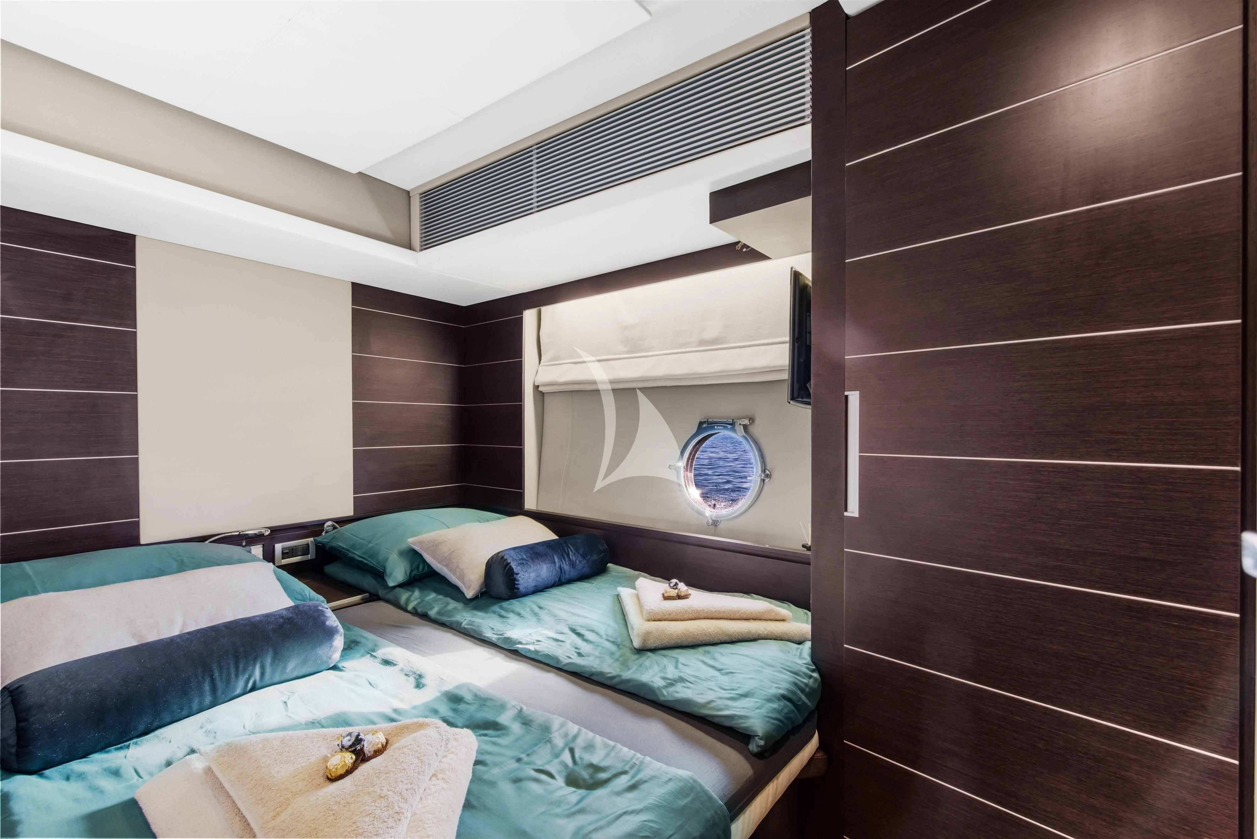 a room with two beds aboard FALCH Yacht for Charter