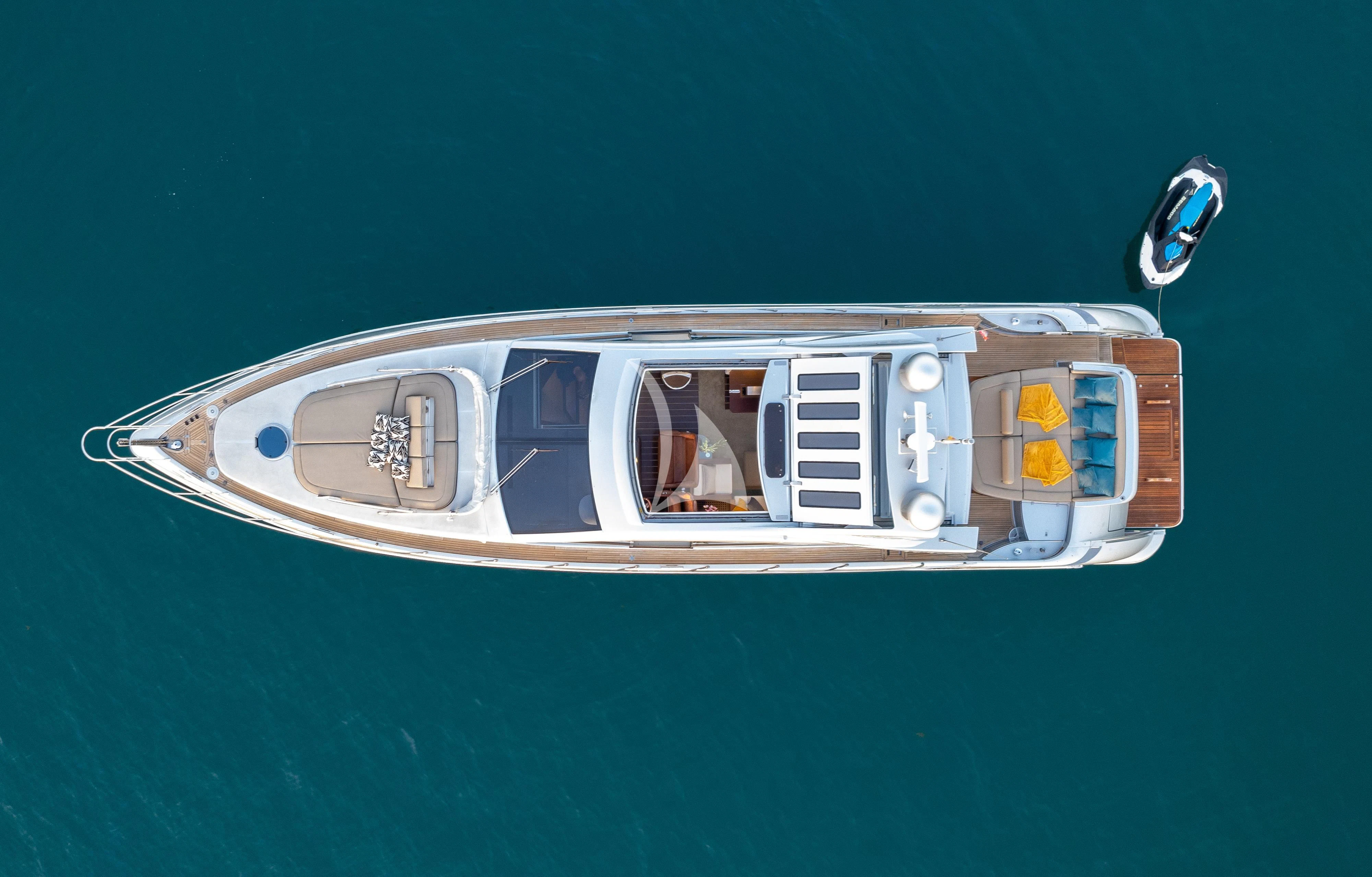 a small wooden boat aboard FALCH Yacht for Charter