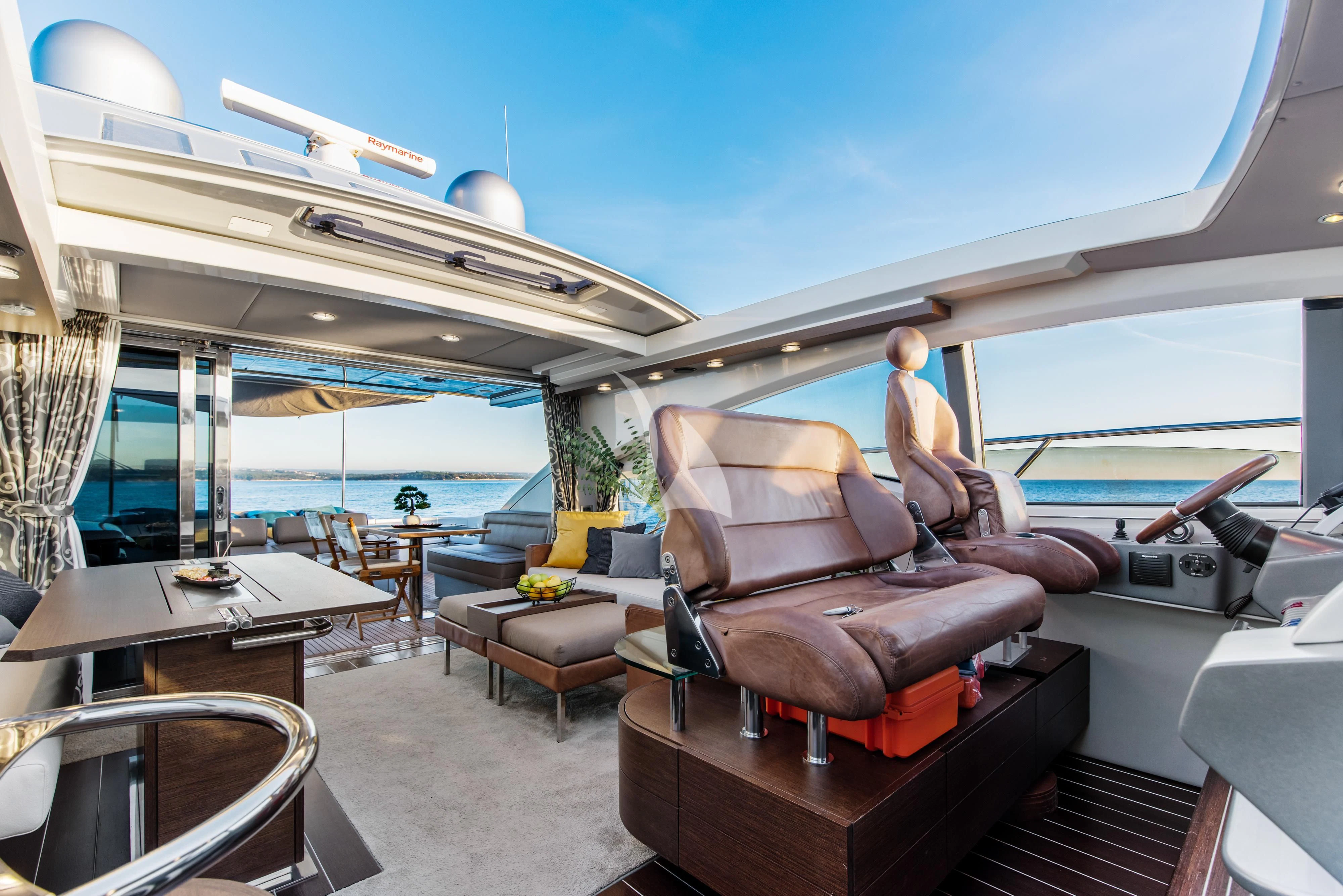 a boat with a person sitting on it aboard FALCH Yacht for Charter
