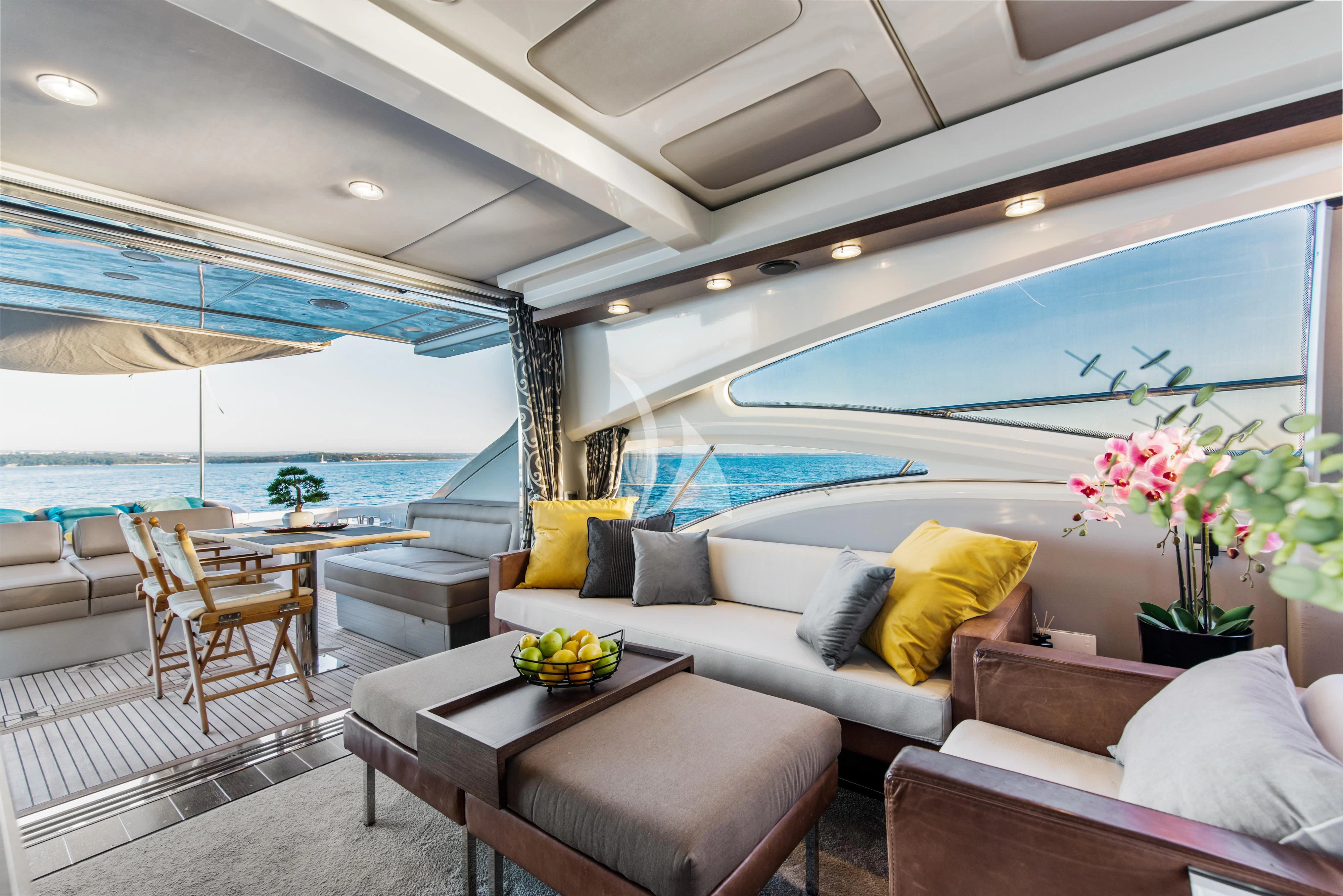 a living room with a large pool aboard FALCH Yacht for Charter