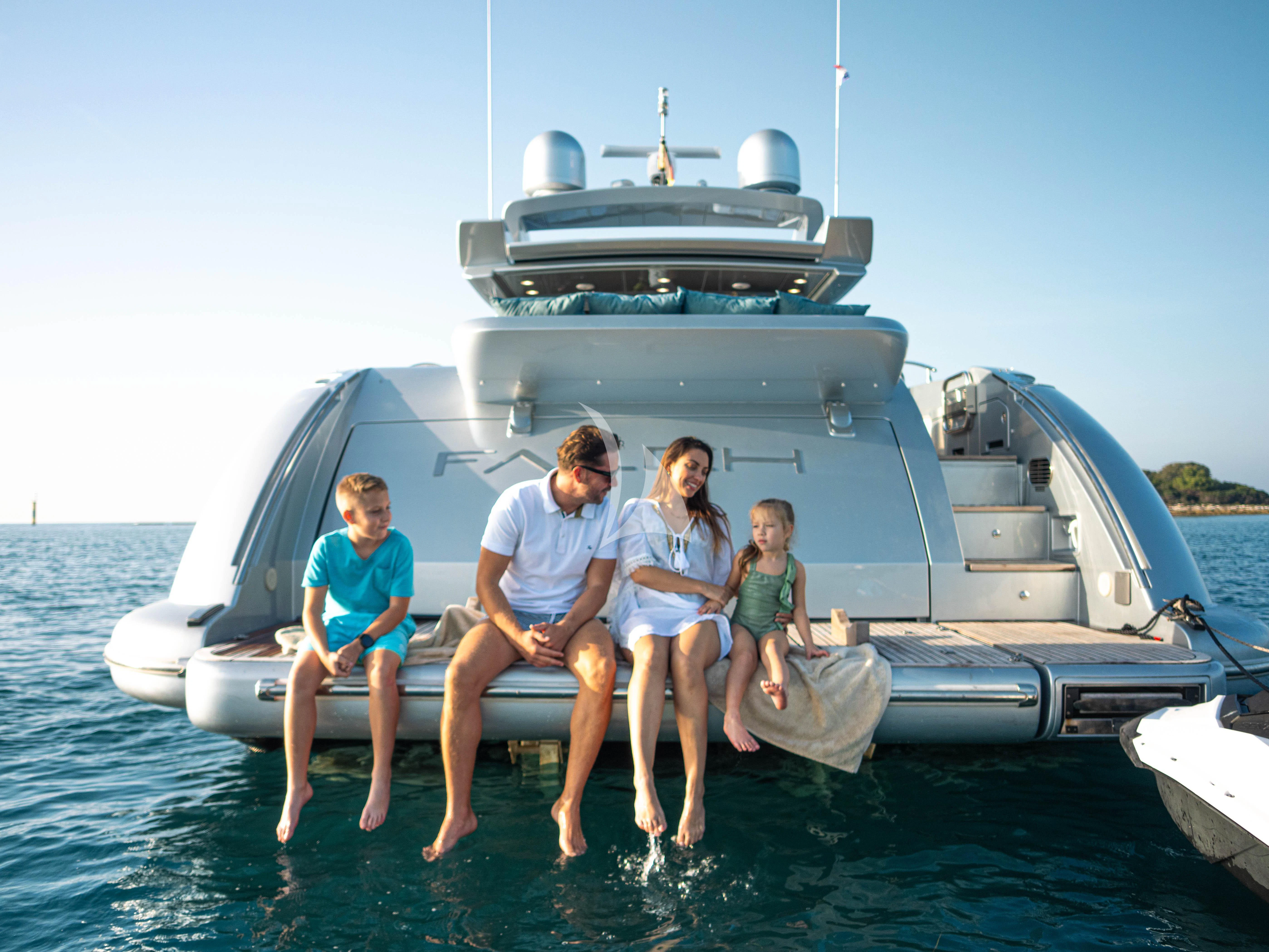 a group of people sitting on a boat in the water aboard FALCH Yacht for Charter