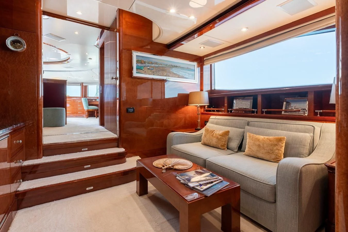 a living room with a couch and a coffee table aboard CHECKMATE Yacht for Charter