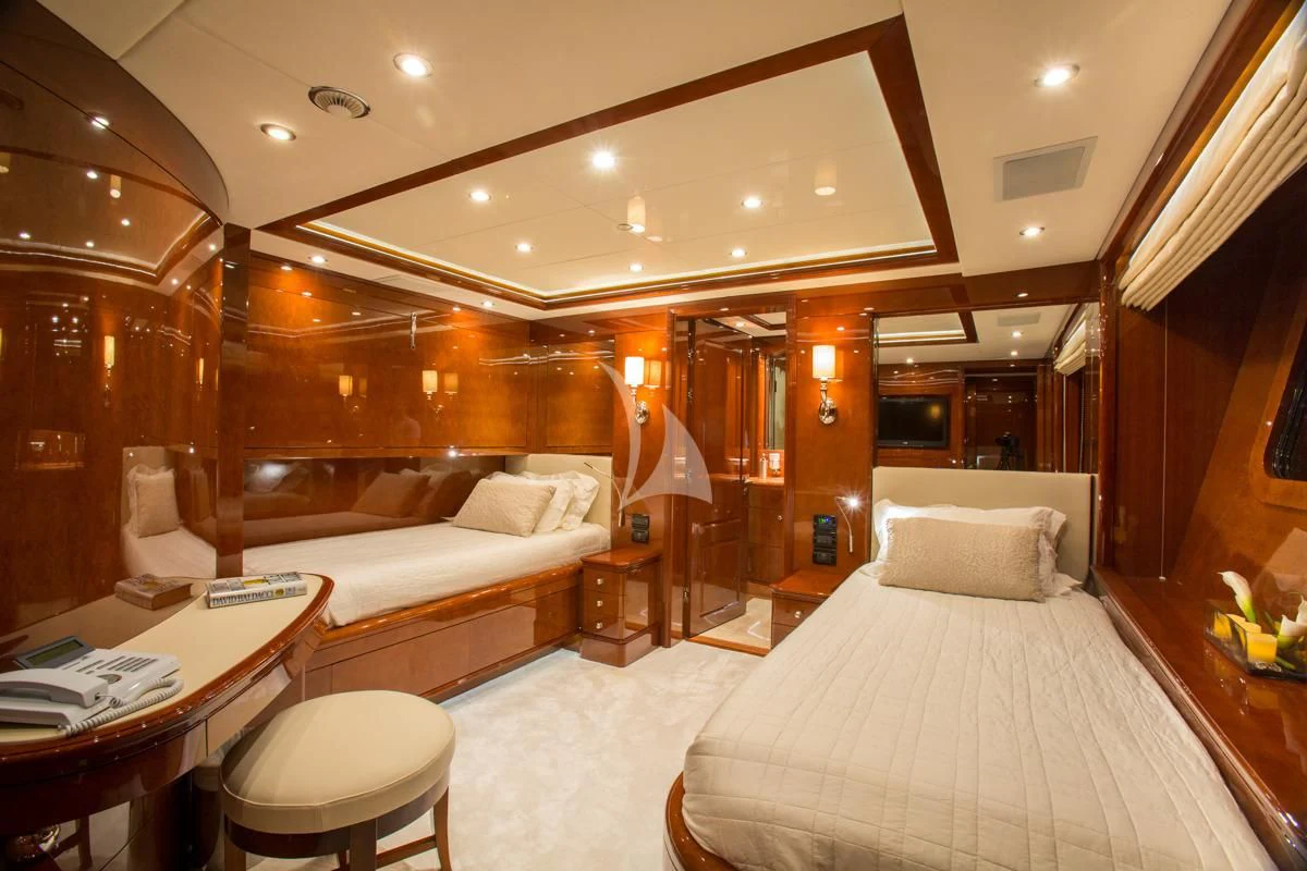a room with a bed and a couch aboard CHECKMATE Yacht for Charter