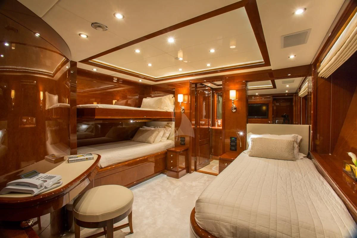 a room with a bed and a table aboard CHECKMATE Yacht for Charter