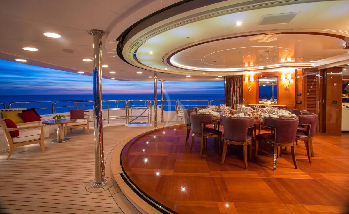 a room with tables and chairs aboard CHECKMATE Yacht for Charter
