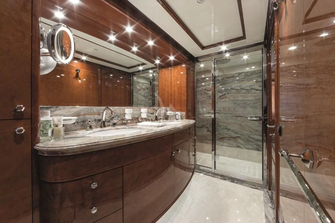 a bathroom with a large mirror aboard CHECKMATE Yacht for Charter