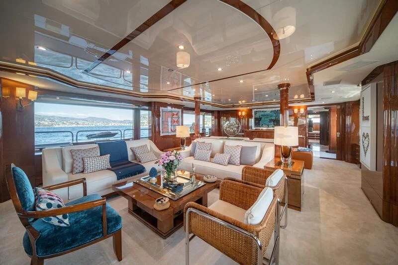 a large living room with a large chandelier aboard CHECKMATE Yacht for Charter