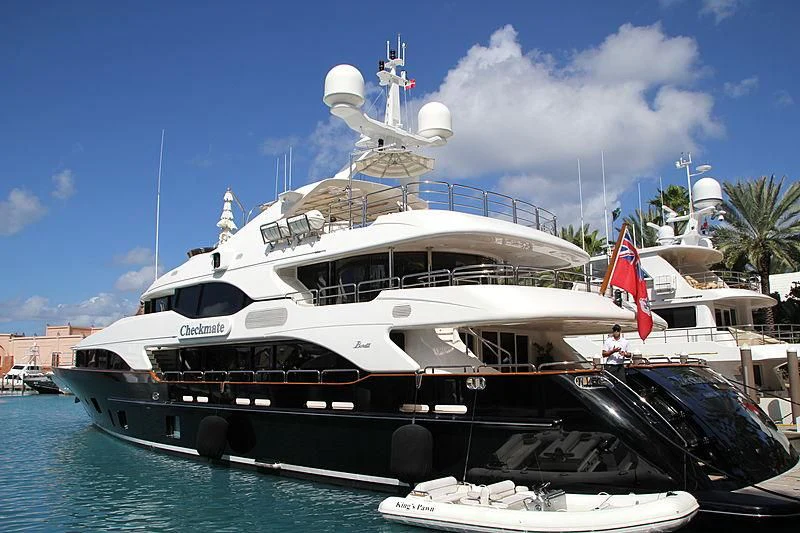 a boat with a flag on it aboard CHECKMATE Yacht for Charter