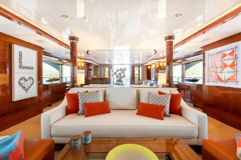 a living room with a white couch aboard CHECKMATE Yacht for Charter