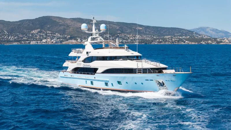 a white boat on the water aboard CHECKMATE Yacht for Charter