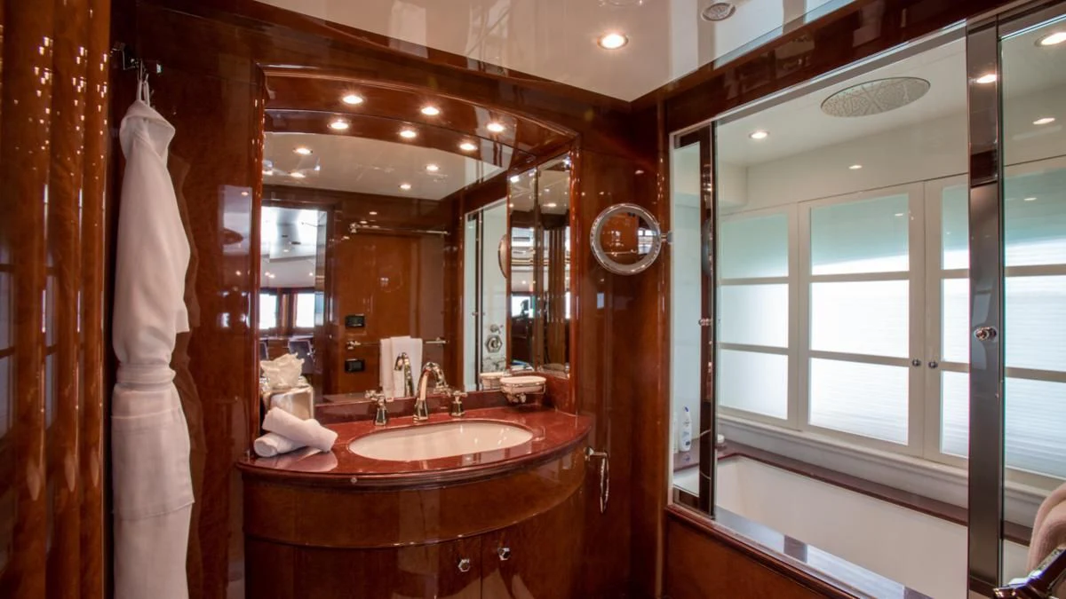 a bathroom with a large mirror aboard CHECKMATE Yacht for Charter