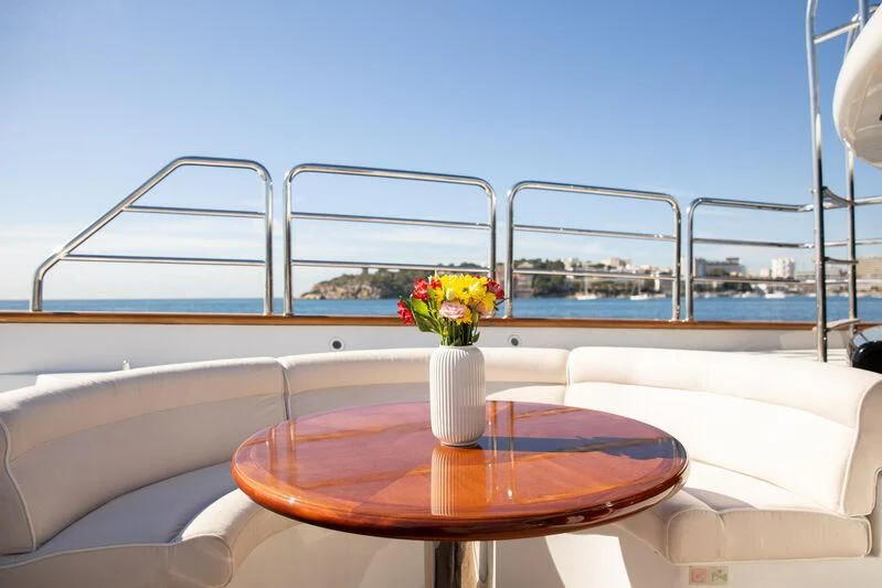 a table with flowers on it aboard CHECKMATE Yacht for Charter