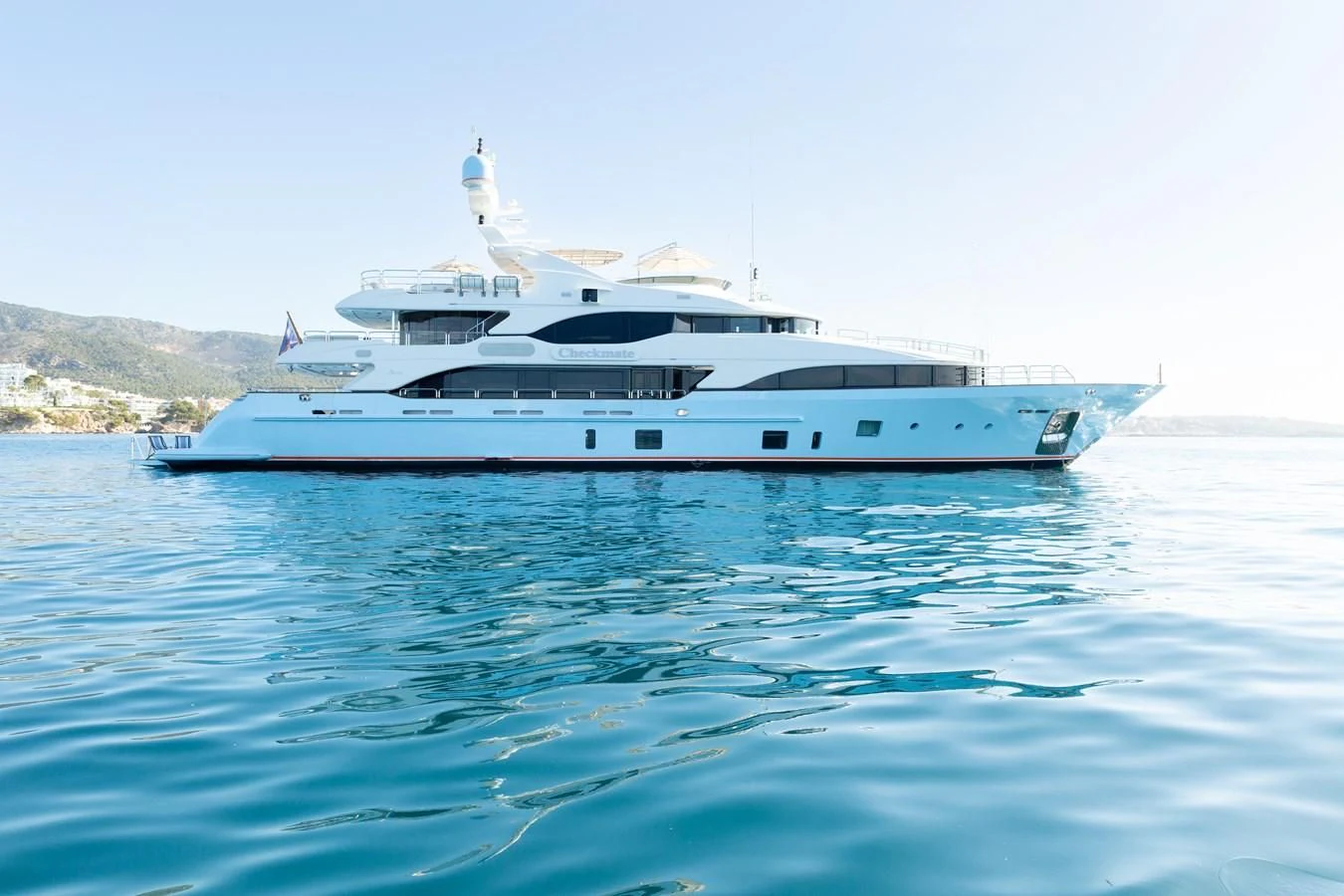 a white yacht in the water aboard CHECKMATE Yacht for Charter