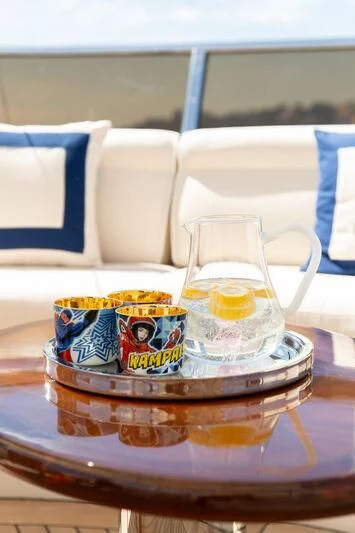 a glass of tea on a table aboard CHECKMATE Yacht for Charter