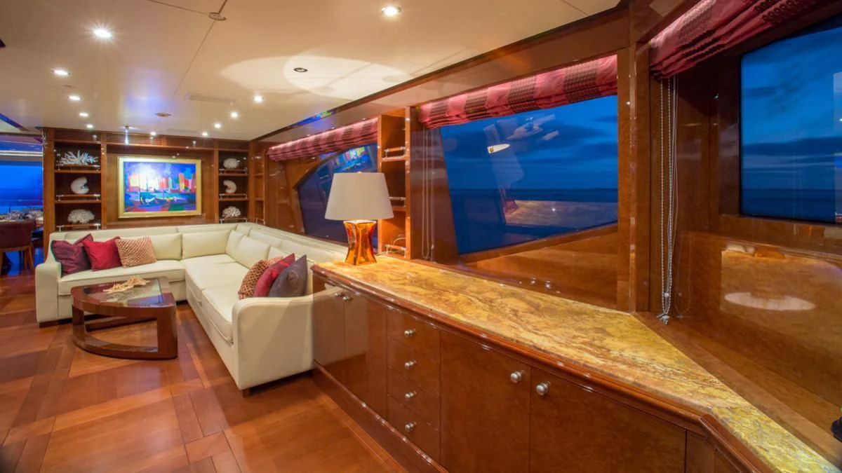 a living room with a large window aboard CHECKMATE Yacht for Charter