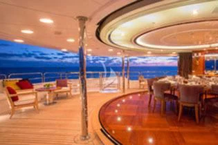 a room with tables and chairs aboard CHECKMATE Yacht for Charter