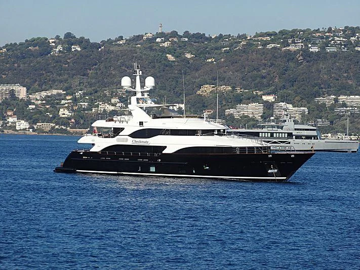 a white boat in the water aboard CHECKMATE Yacht for Charter